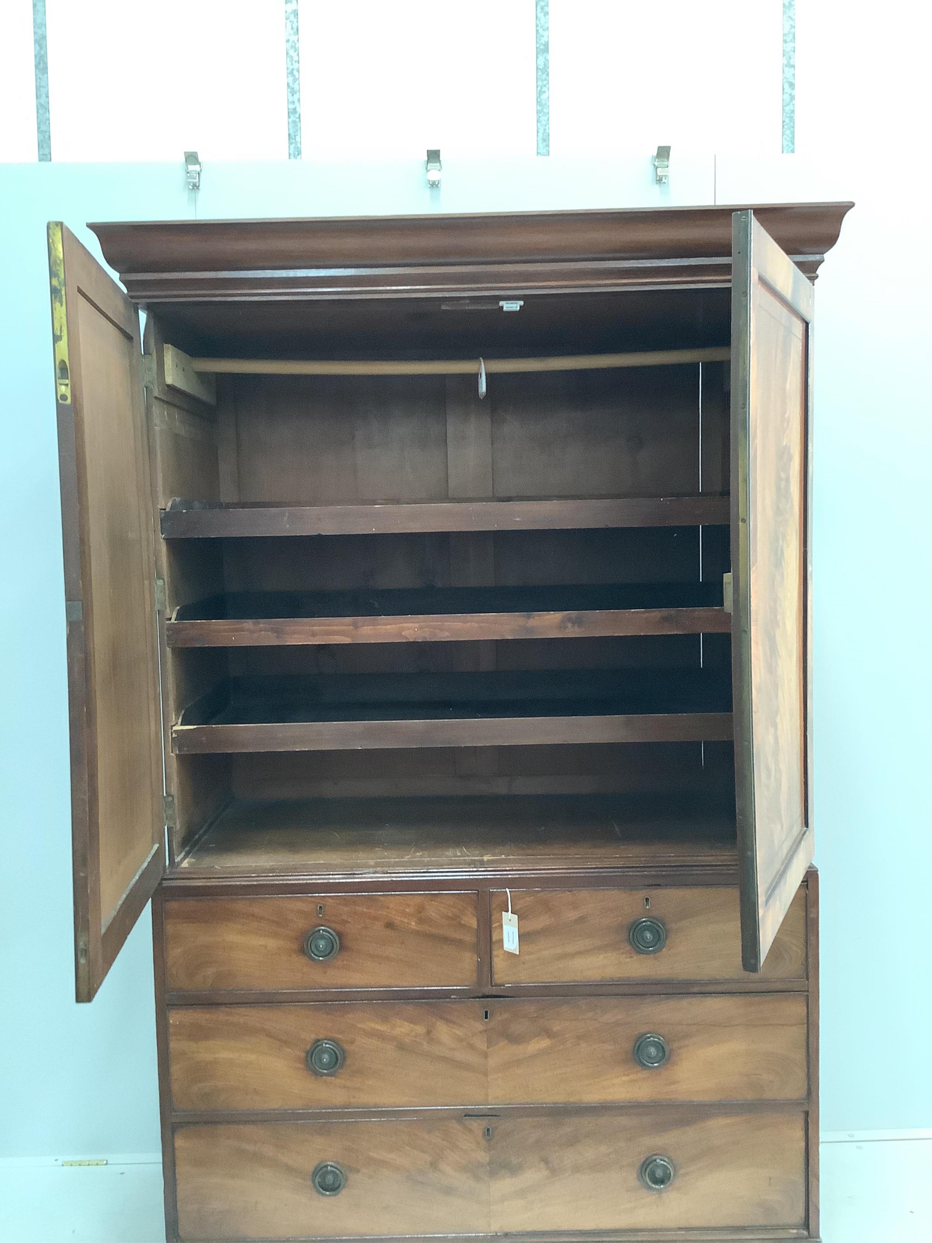 A George IV and later mahogany linen press, width 130cm, depth 60cm, height 205cm. Condition - fair